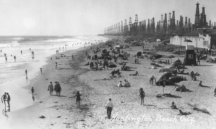 Fascinating photo of Huntington Beach oil derricks, a rare glimpse into American history.