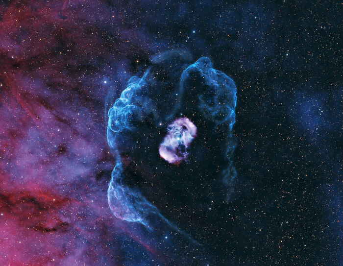 David Malin Astrophotography Awards entry showcasing a vibrant blue and purple nebula against a star-filled sky.