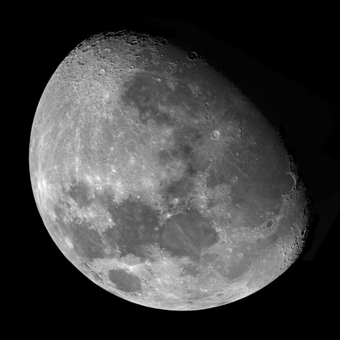 A captivating astrophotography image of Earth's moon, revealing detailed craters, a highlight from the David Malin Astrophotography Awards.
