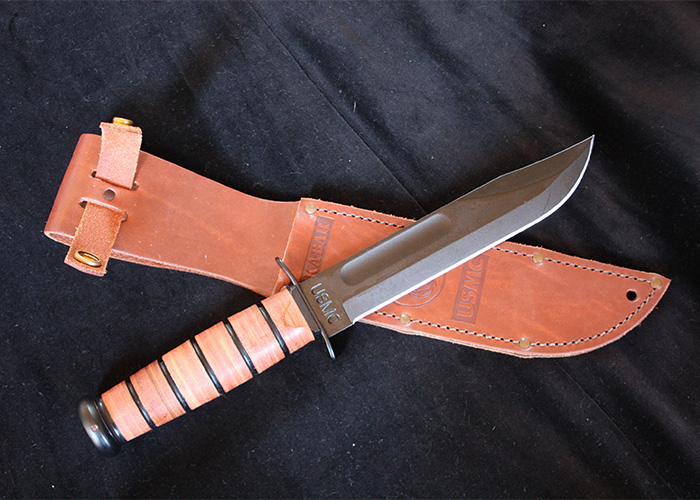 A Ka-Bar knife with a brown leather sheath. This image relates to details in Bryan Kohberger's case.