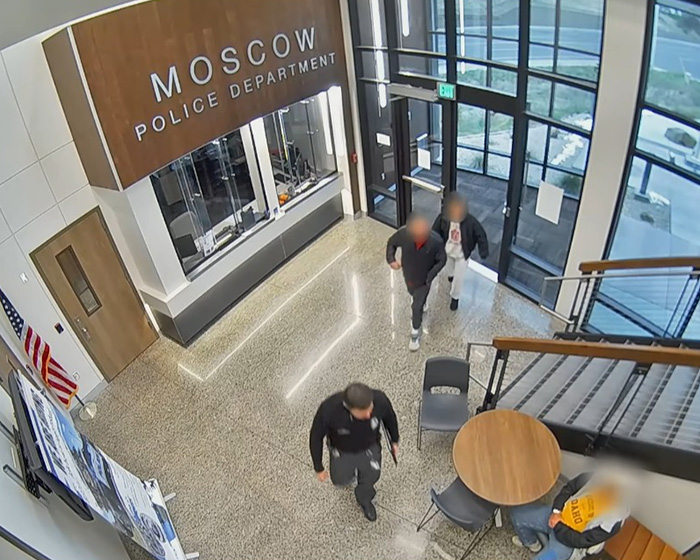 Overhead view of the Moscow Police Department lobby with people walking. Questionable details in Bryan Kohberger's case.