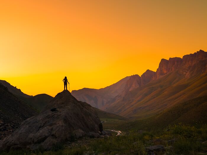 Murat Bakmaz captures the easily missed beauty of a lone figure standing atop a mountain at sunset.