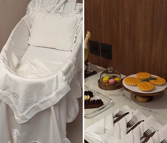 A luxurious maternity suite featuring a white bassinet and a table with gourmet snacks.