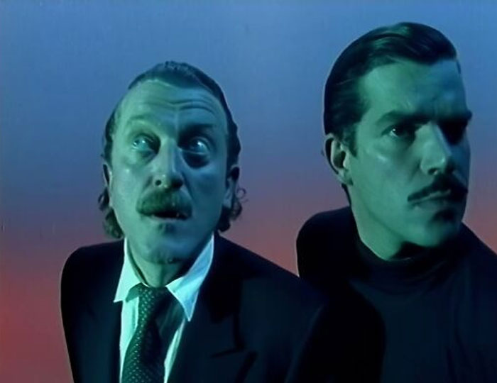 Two men with expressive faces looking up, representing the surprising ways people get rich.