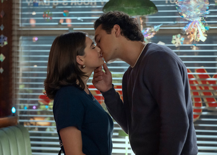 A couple sharing a kiss, amidst discussions of Gen Z rejecting intimate acts.