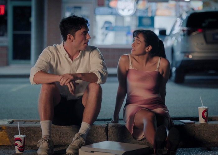 Gen Z couple sitting by the roadside, discussing the future and intimate acts.
