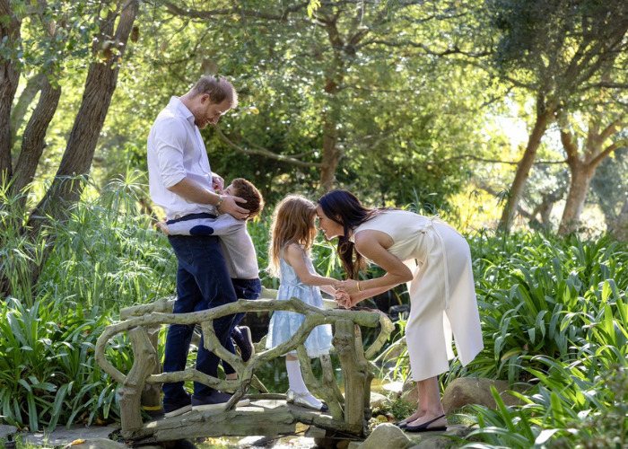 Meghan Markle, Prince Harry, and their children on a bridge, as former US neighbors expose further revelations.