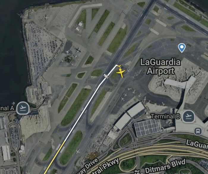 Aerial view of LaGuardia Airport runway, illustrating Air Traffic Controllers' role in preventing an Air Canada crash. Aerial view of LaGuardia Airport runway, illustrating Air Traffic Controllers' role in preventing an Air Canada crash.