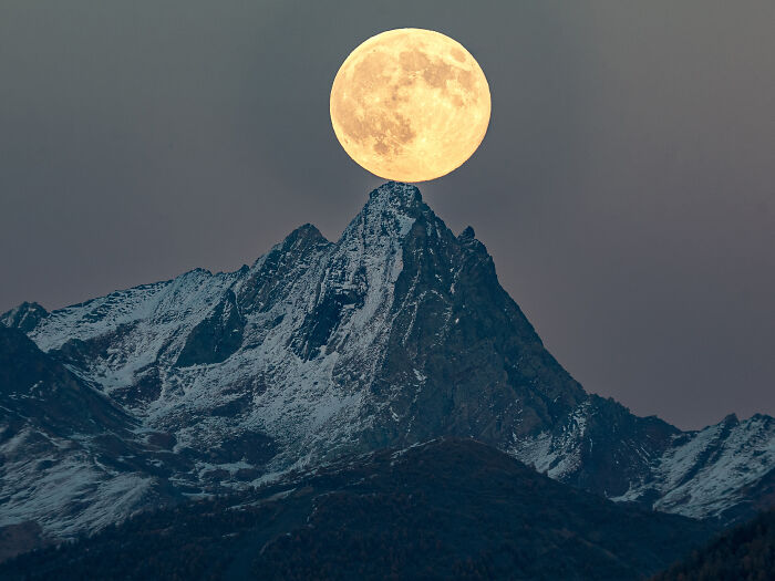 Majestic astronomy photo of a full moon above mountains, a jaw-dropping ZWO shortlist image from 2026.