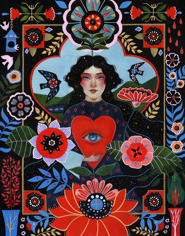 Aunia Kahn folk-inspired artwork of a woman holding a heart with an eye, surrounded by vibrant flowers and symbols.