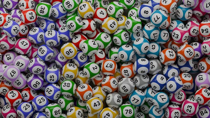 A pile of colorful lottery balls, representing the chance to win a jackpot. A pile of colorful lottery balls, representing the chance to win a jackpot.