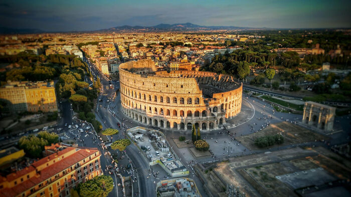 An aerial view of the Colosseum in Rome, a common site for absurd American questions to Europeans.