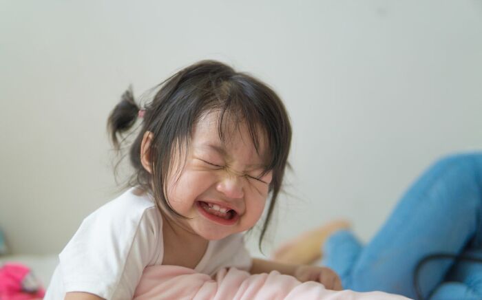 A young child crying, illustrating ridiculous reasons for conflict.