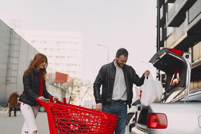 A couple loading groceries into a car, showing one of the ridiculous reasons that left others seeing red.