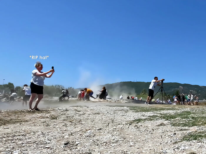 Woman injured by a plane's jet engine as bystanders watch in shock from the ground.
