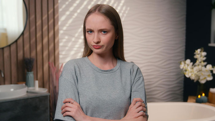 Woman looking upset after being adopted by stepmom and brother refusing to share inheritance. Woman looking upset after being adopted by stepmom and brother refusing to share inheritance.