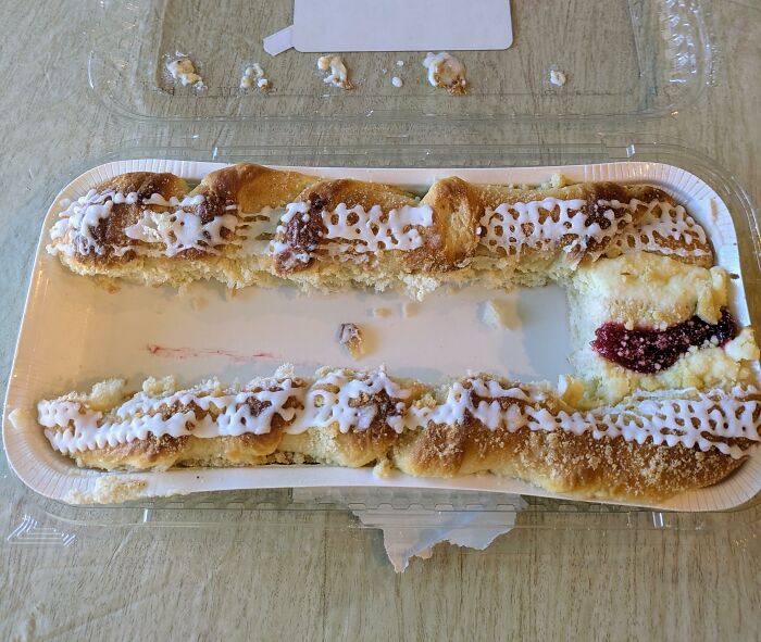 A partially eaten pastry in a container, illustrating a parent's wrong way to solve a problem with food.