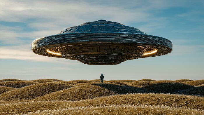 A conceptual image of a UFO hovering over a field with a person, contrasting with the real purpose of Area 51 beyond aliens. A conceptual image of a UFO hovering over a field with a person, contrasting with the real purpose of Area 51 beyond aliens.