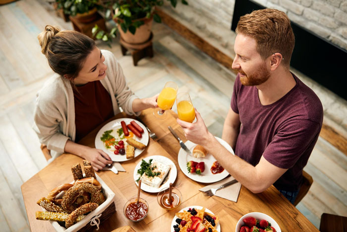 Bestie pulls away after supporting woman through divorce, as a couple toasts with juice over a breakfast spread. Bestie pulls away after supporting woman through divorce, as a couple toasts with juice over a breakfast spread.