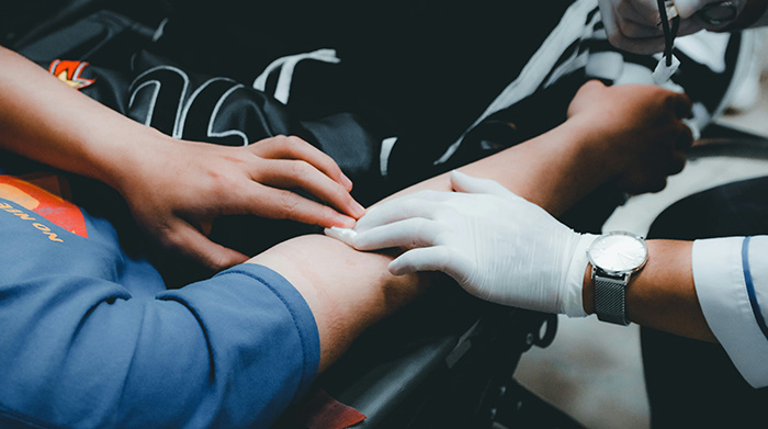 A close-up of a person's arm being prepped for a blood donation, related to an adopted teen's birth parents demand. A close-up of a person's arm being prepped for a blood donation, related to an adopted teen's birth parents demand.