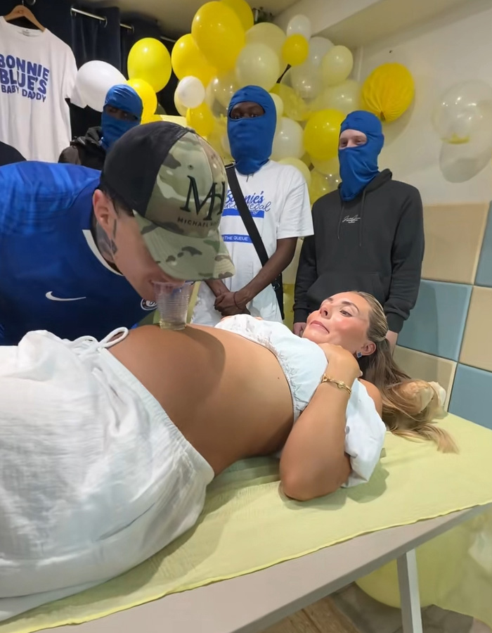 Bonnie Blue at a 'Minging' event, a man drinking from her baby bump while others watch. Bonnie Blue at a 'Minging' event, a man drinking from her baby bump while others watch.