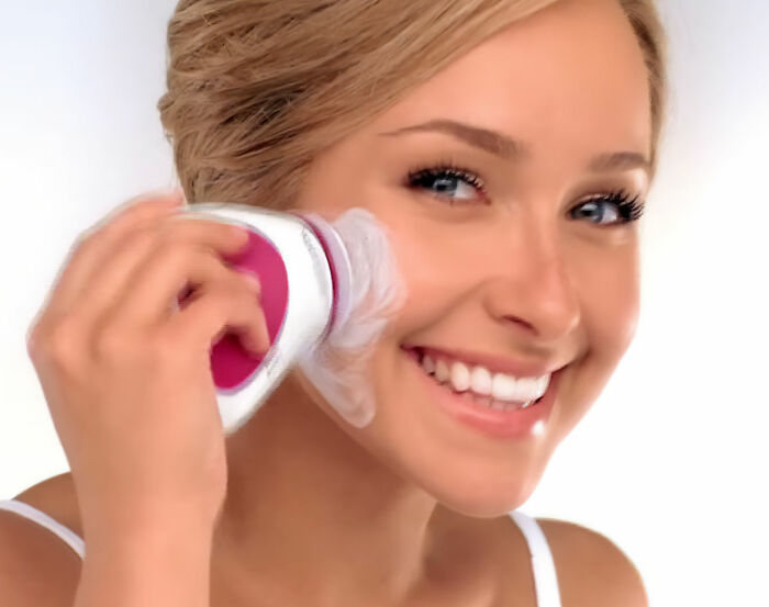 Woman using a Neutrogena product, image related to Neutrogena's stock tumble after Hayden Panettiere's passing and fan boycott.