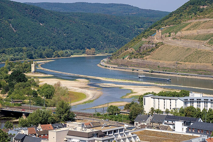 Europe suffers brutal drought: an aerial view of the Rhine River, showing severely reduced water levels and exposed riverbed.