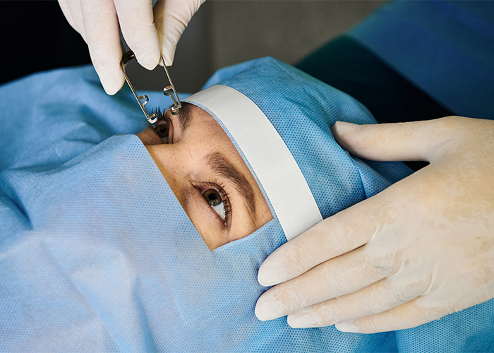 A patient during eye surgery, potentially preparing to perceive the new color Olo.