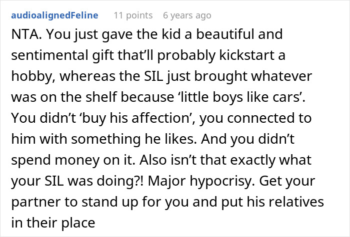 A comment supporting a stepmom buying her stepson love with gifts, calling out hypocrisy.