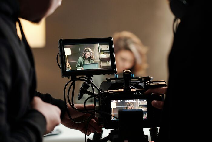 A person filming a video, demonstrating insider knowledge in media and production industries.