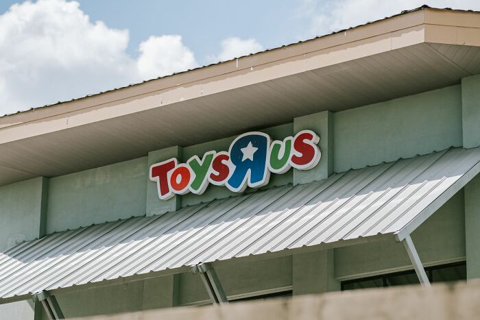 The colorful Toys R Us logo on the exterior of a building, representing companies that used to dominate the market.
