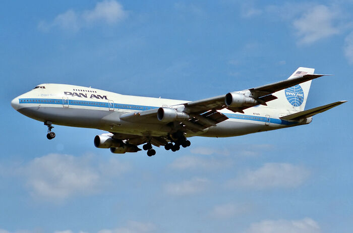 A Pan Am airplane soaring through the sky, symbolizing companies that used to dominate the market.