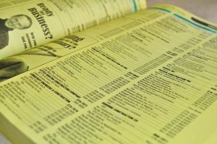 A close-up of a yellow pages directory, representing companies that used to dominate the market.