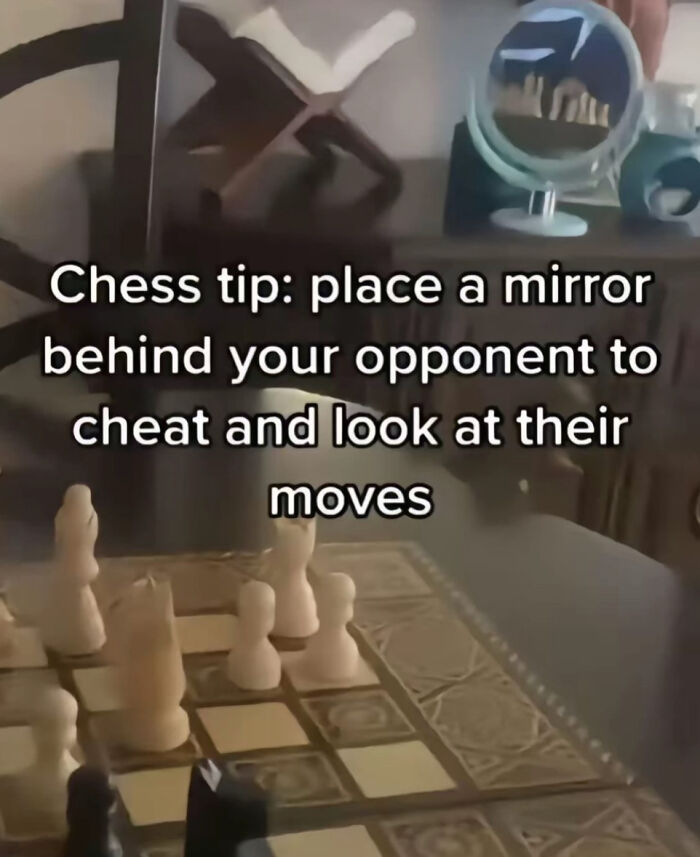A chess board with a mirror behind it for cheating, showcasing a dumb person's tactic. 