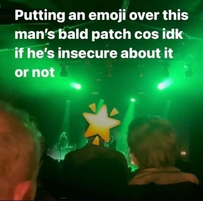 An emoji covering a mans bald patch at a concert, an act by dumb people to avoid insecurity.