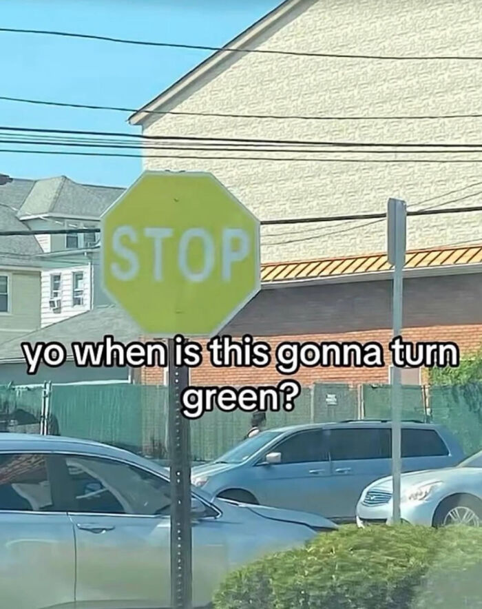 A stop sign with the text yo when is this gonna turn green? showing a lack of understanding.