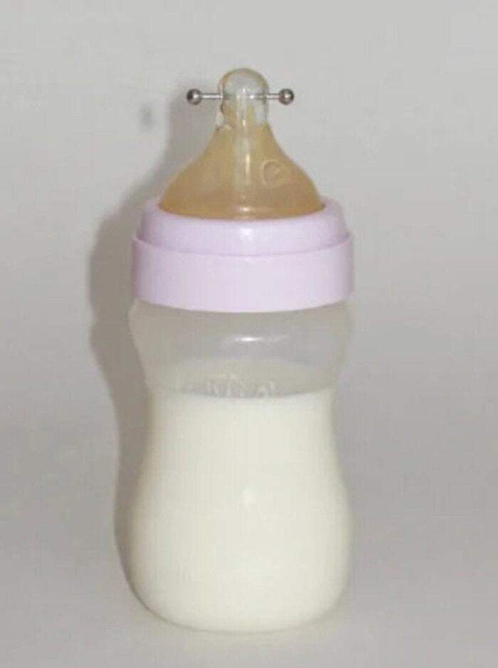 A baby bottle with n****e piercings, one of the pics people cannot explain.