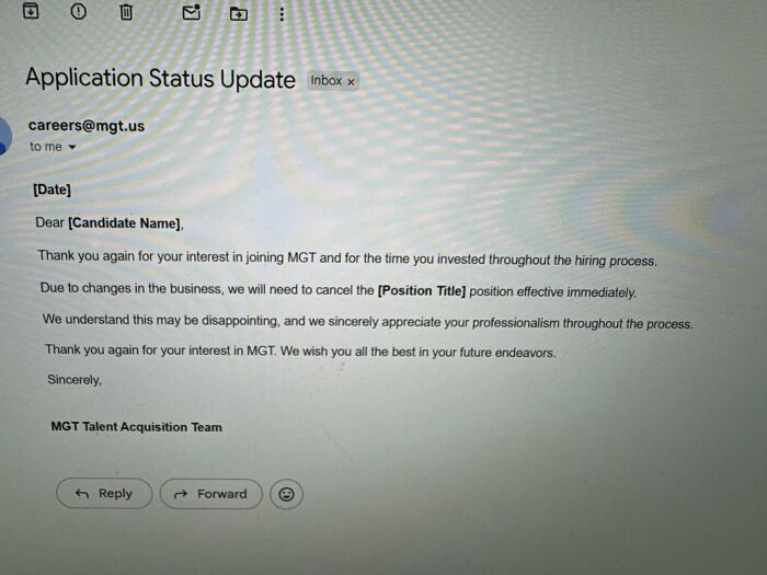 An email displaying an application status update, cancelling a job position due to business changes, a corporate absurdity.
