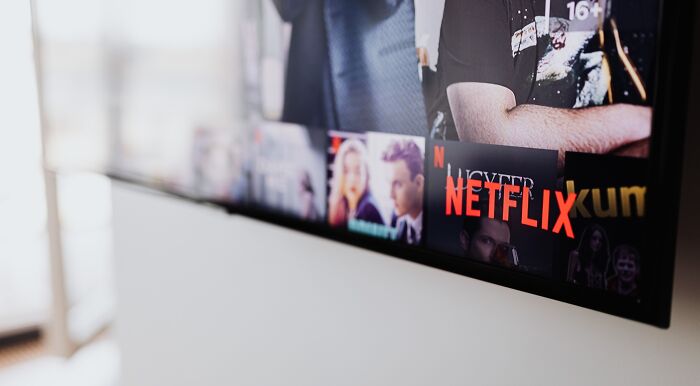 A TV screen displaying Netflix, with various favorite shows and movie titles, perfect for a career quiz.