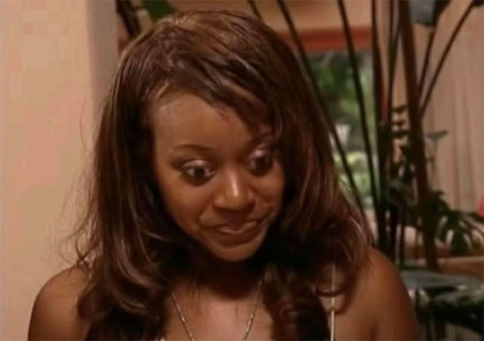A woman with a shocked expression, representing women catching their soulmates cheating.