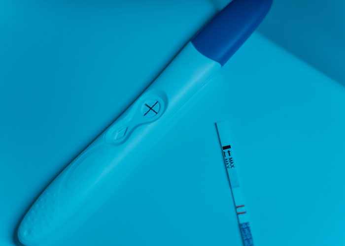 A pregnancy test showing a positive result, hinting at a baby, and how women caught cheating soulmates.