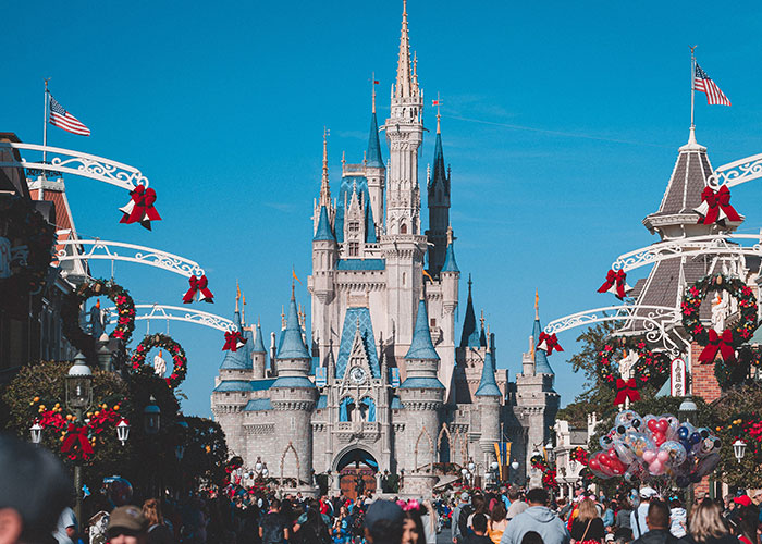 Cinderella's castle with Christmas decorations, symbolizing fairytale expectations and the reality of women catching cheating partners.