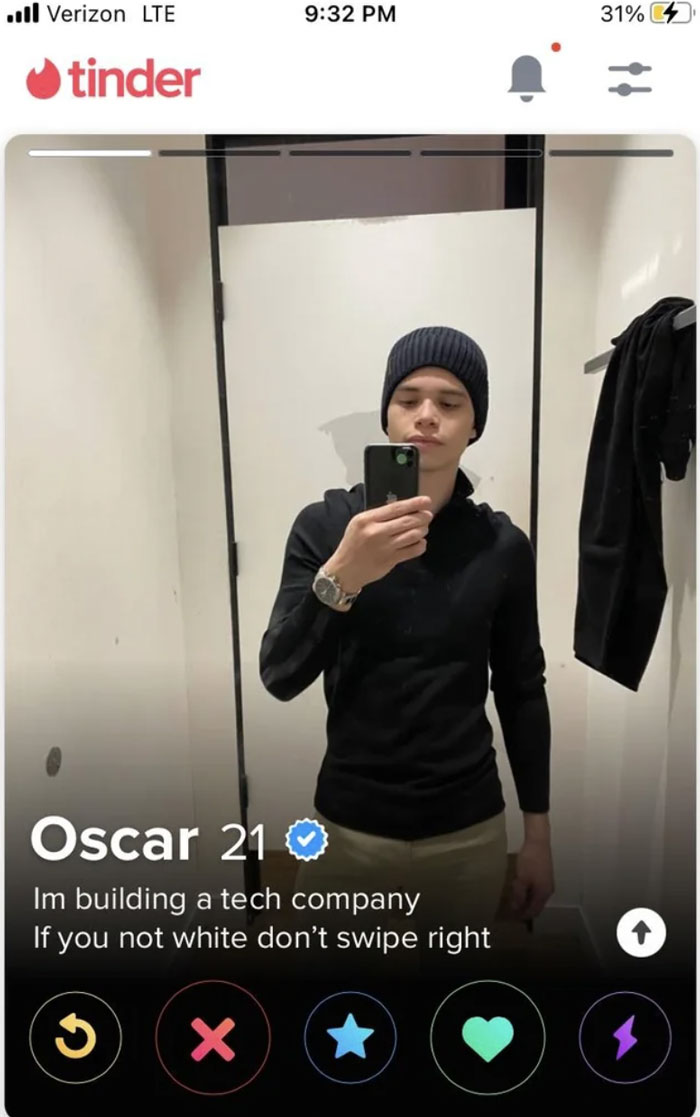 A wild and cringey online dating screenshot of Oscar, 21, posing in a mirror with a racially exclusive bio.