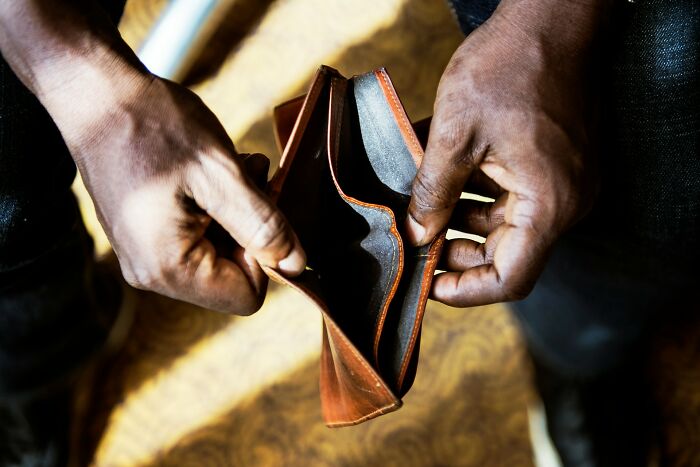 Empty wallet, depicting financial struggles and poverty habits.