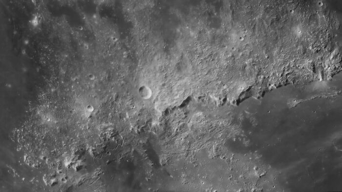 Cratered lunar surface, a breathtaking image from the David Malin Astrophotography Awards 2026.