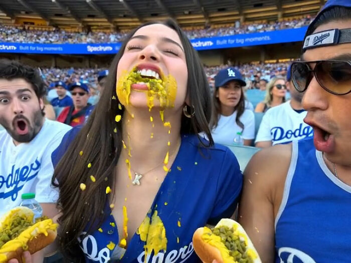 Mario Lopez's niece with hot dog toppings smeared on her face, alongside Mario Lopez looking shocked.
