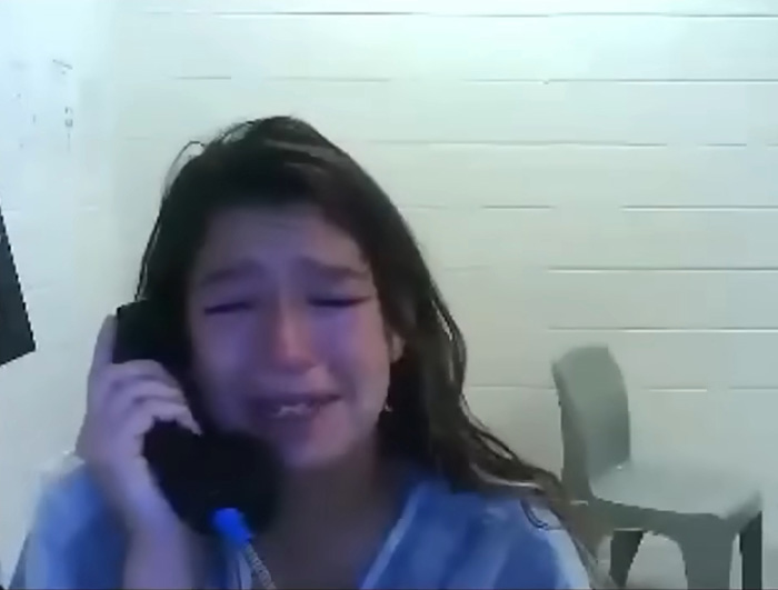 A crying daughter in a jailhouse call, reflecting the emotional aftermath of a drunken incident. A crying daughter in a jailhouse call, reflecting the emotional aftermath of a drunken incident.
