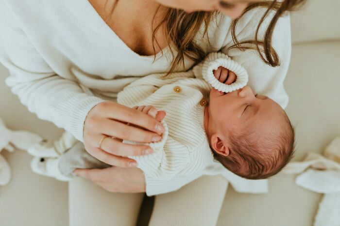 A mother cradles her newborn baby. Doctors reveal the diagnoses that were the hardest to deliver.