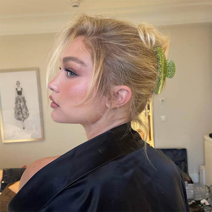 Blonde woman with hair accessory, a claw clip, in a messy bun, highlighting life threatening injuries from hair accessories.