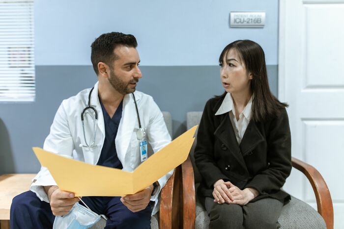 Pink taxes affecting women: A doctor talking to a woman, discussing the financial difficulties women face.